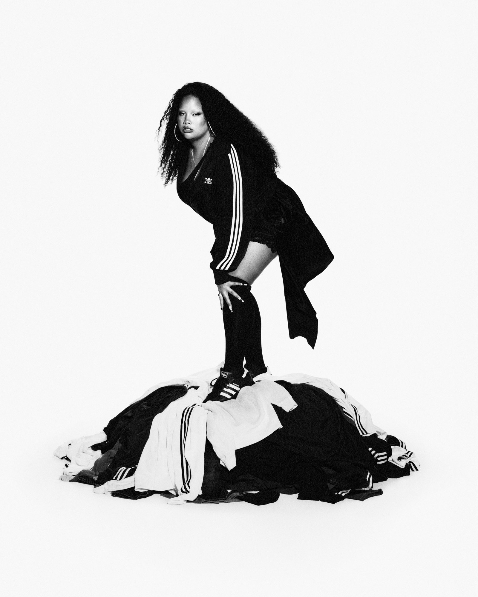 Shygirl on clothes mountain